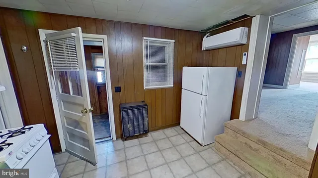 a view of a room with a fireplace and a window