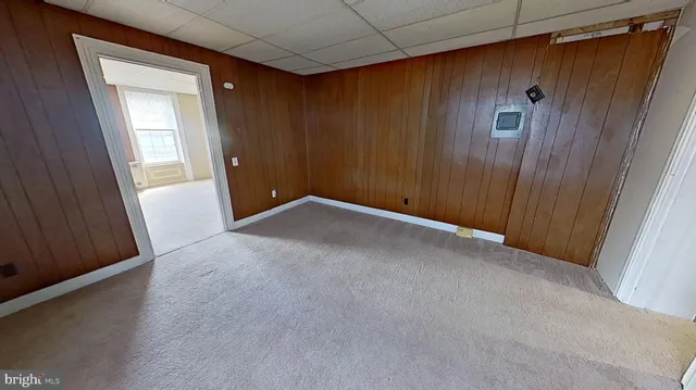 a view of an empty room with a fireplace