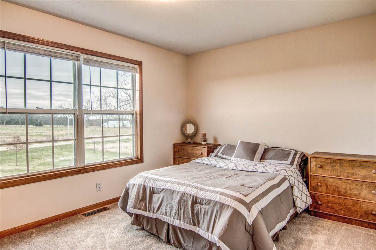 9430 Edson Road Capron, IL 61012 - Photo 14 of 25 a bedroom with a bed and a window