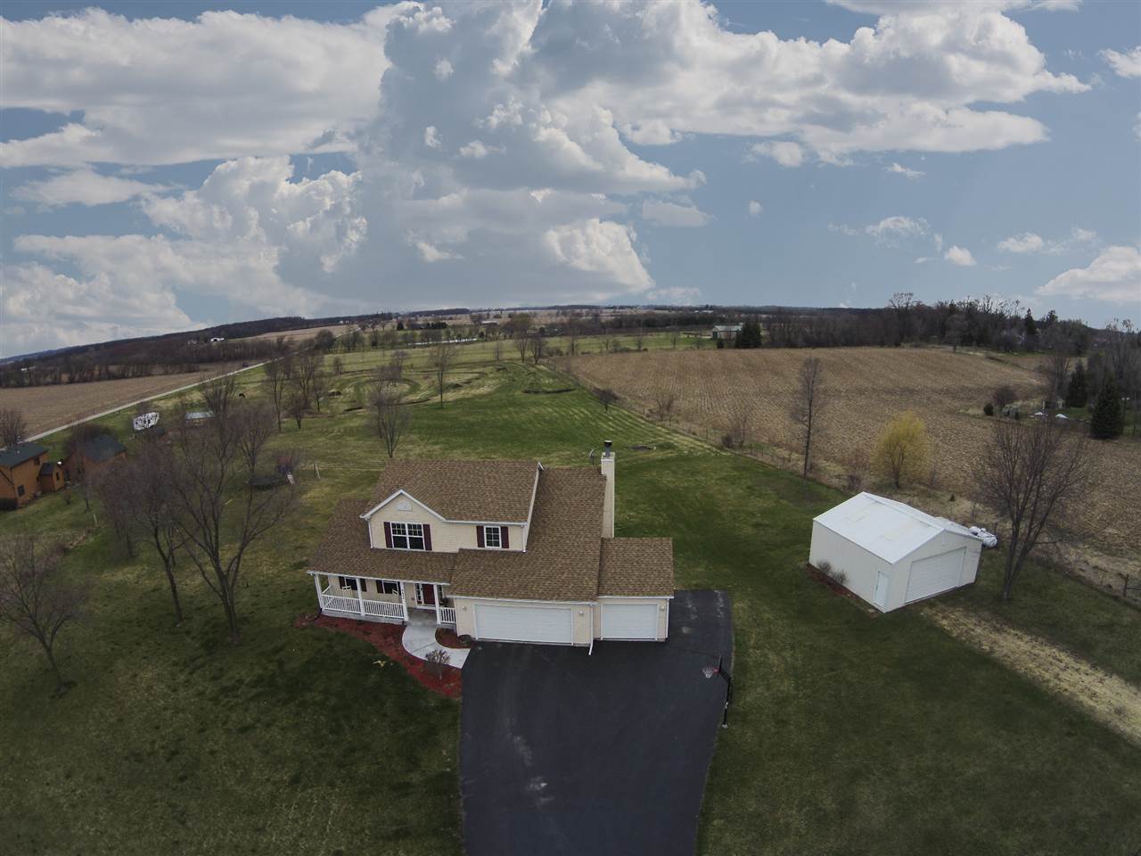 9430 Edson Road Capron, IL 61012 - Photo 2 of 25 an aerial view of a house with a lake view