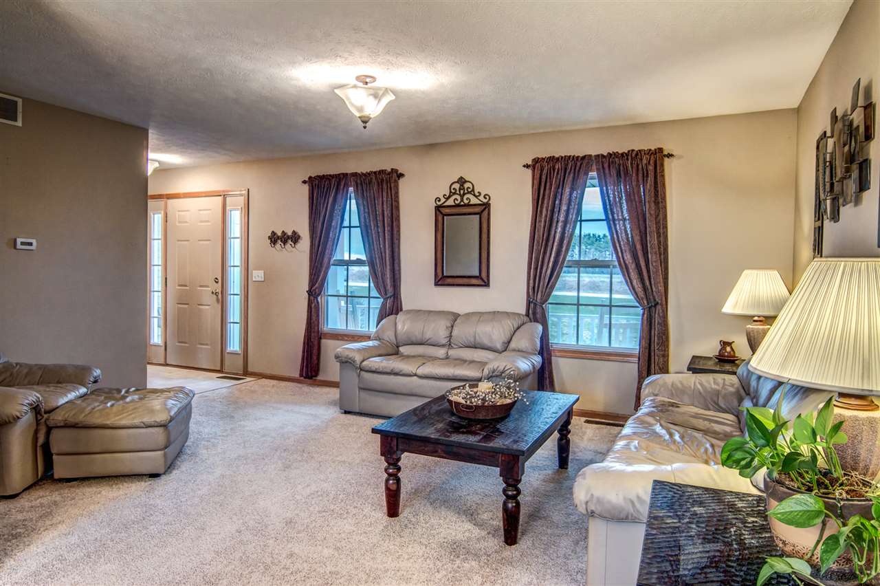 9430 Edson Road Capron, IL 61012 - Photo 3 of 25 a living room with furniture and a window