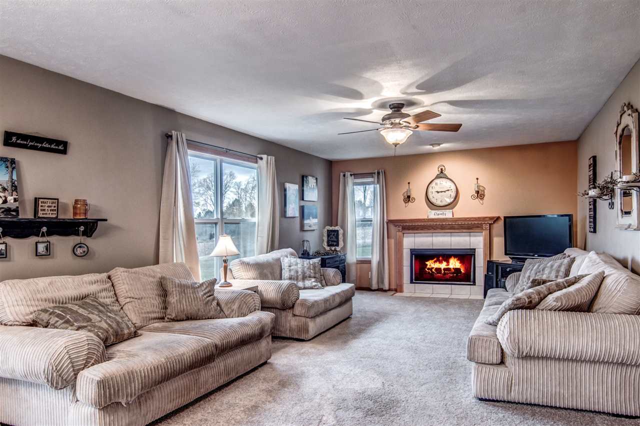 9430 Edson Road Capron, IL 61012 - Photo 8 of 25 a living room with furniture and a fireplace