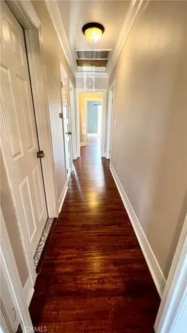 a view of gallery with wooden floor