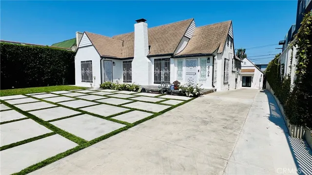 a front view of a house with yard