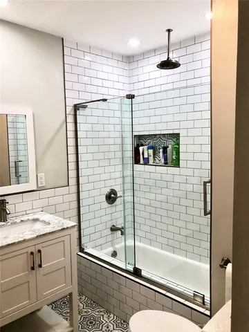 a bathroom with a shower and a sink