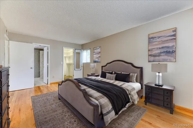 a bed room with a bed and a night stand