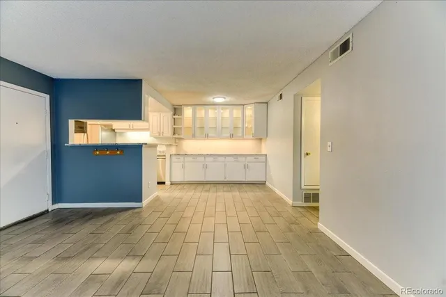 a view of a kitchen with a sink and a window