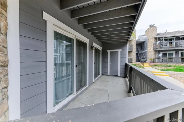 a view of an outdoor kitchen and a sink