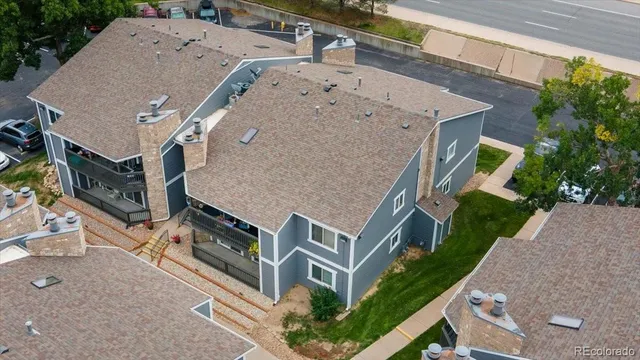 an aerial view of a house with a yard