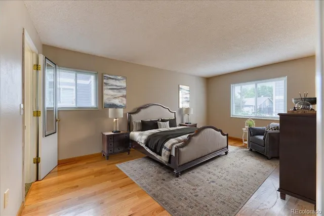 a bedroom with bed and window