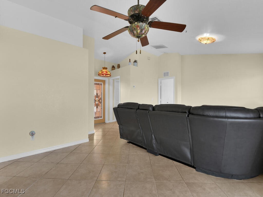 4370 20th Street Northeast Naples, FL 34120 - Photo 14 of 35 a living room with furniture and a ceiling fan