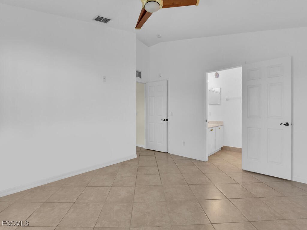4370 20th Street Northeast Naples, FL 34120 - Photo 17 of 35 wooden floor in an empty room