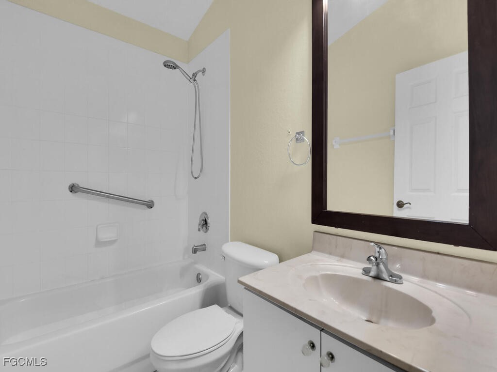 4370 20th Street Northeast Naples, FL 34120 - Photo 23 of 35 a bathroom with a sink toilet and shower