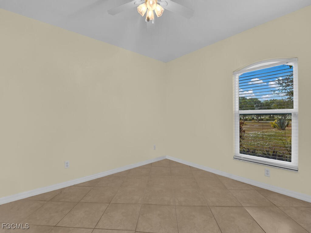 4370 20th Street Northeast Naples, FL 34120 - Photo 25 of 35 an empty room with a window