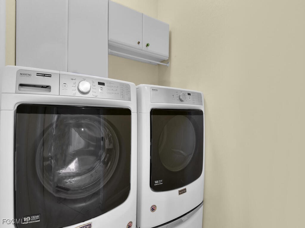 4370 20th Street Northeast Naples, FL 34120 - Photo 27 of 35 a utility room with dryer and washer