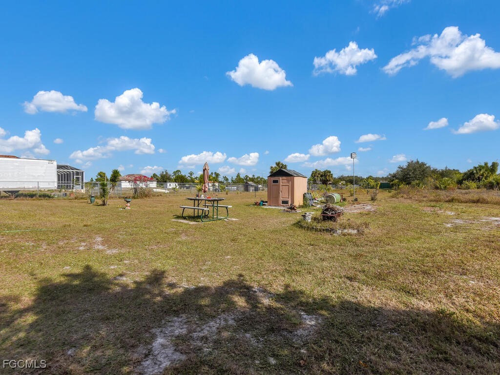 4370 20th Street Northeast Naples, FL 34120 - Photo 30 of 35 a view of a house with a big yard