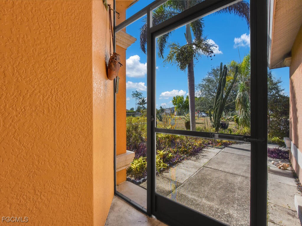 4370 20th Street Northeast Naples, FL 34120 - Photo 32 of 35 a view of a porch with a yard