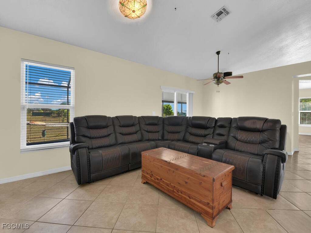 4370 20th Street Northeast Naples, FL 34120 - Photo 10 of 35 a living room with furniture and a window