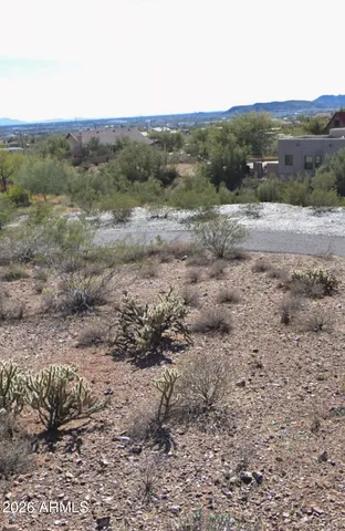 a view of a dirt road with mountain view