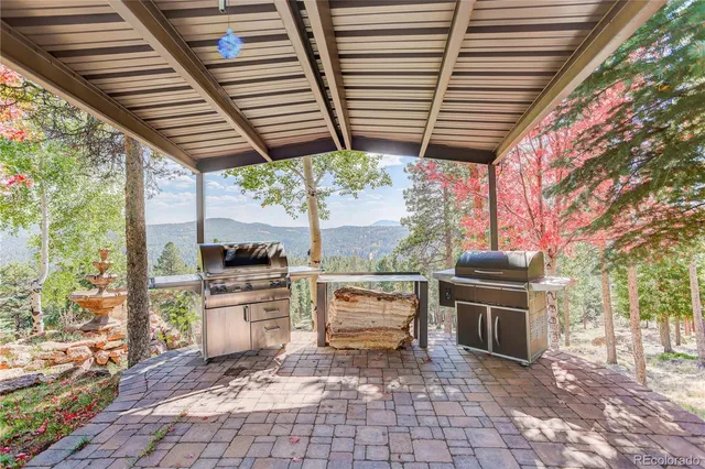 a view of a chairs and table in the patio