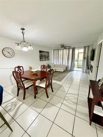 a view of a livingroom with an empty space and a fireplace