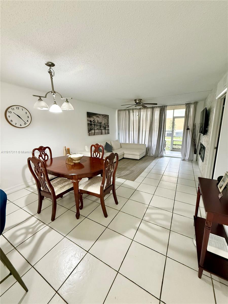 8246 Northwest 24th Street, Unit 8246 Coral Springs, FL 33065 - Photo 11 of 27 a view of a dining room with furniture