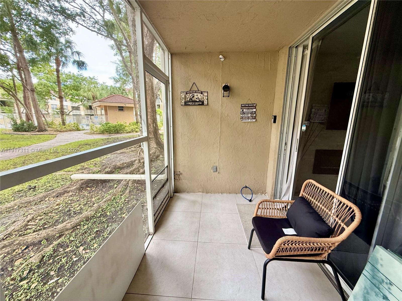 8246 Northwest 24th Street, Unit 8246 Coral Springs, FL 33065 - Photo 23 of 27 a view of balcony with furniture