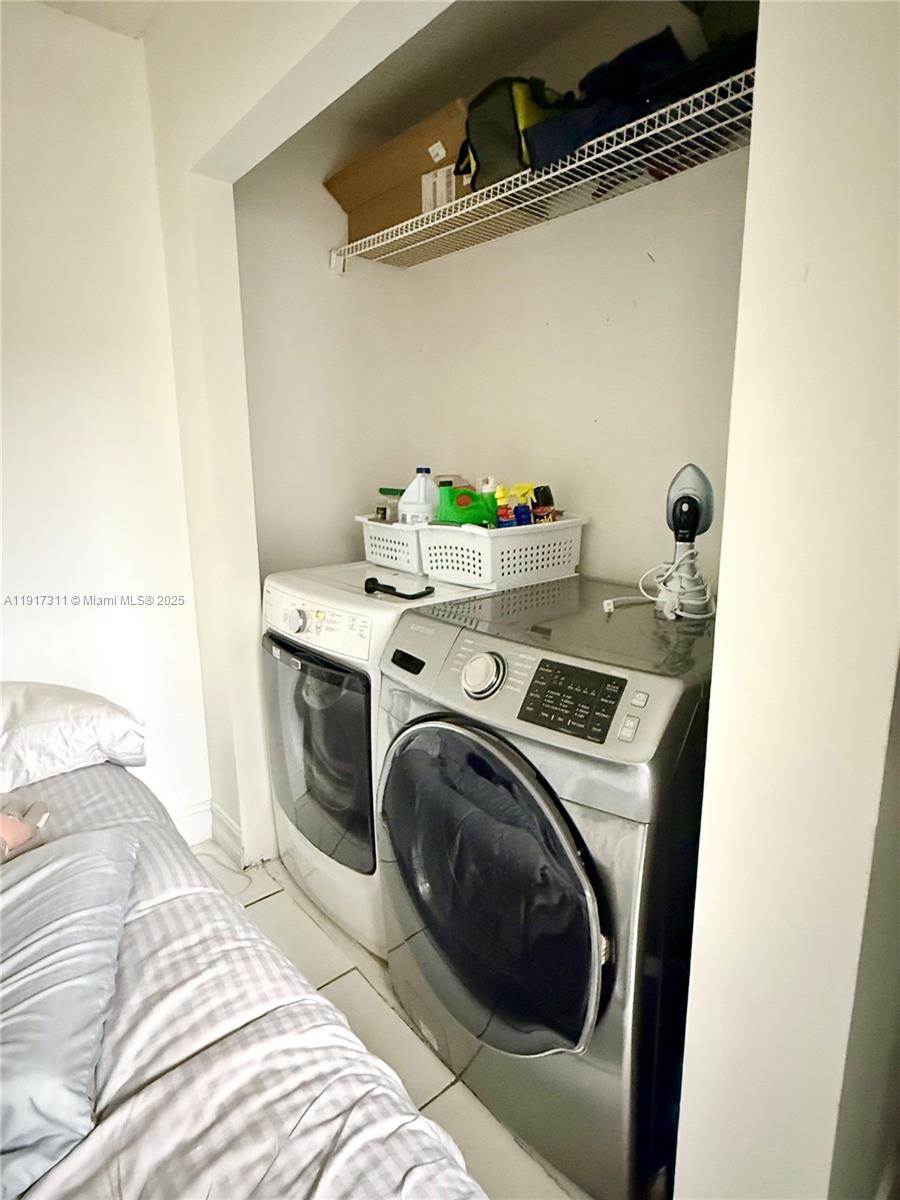 8246 Northwest 24th Street, Unit 8246 Coral Springs, FL 33065 - Photo 25 of 27 a utility room with dryer and washer