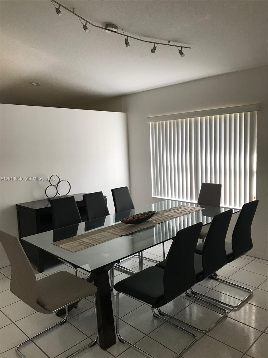 16654 Southwest 103rd Lane Miami, FL 33196 - Photo 3 of 20 a living room with furniture