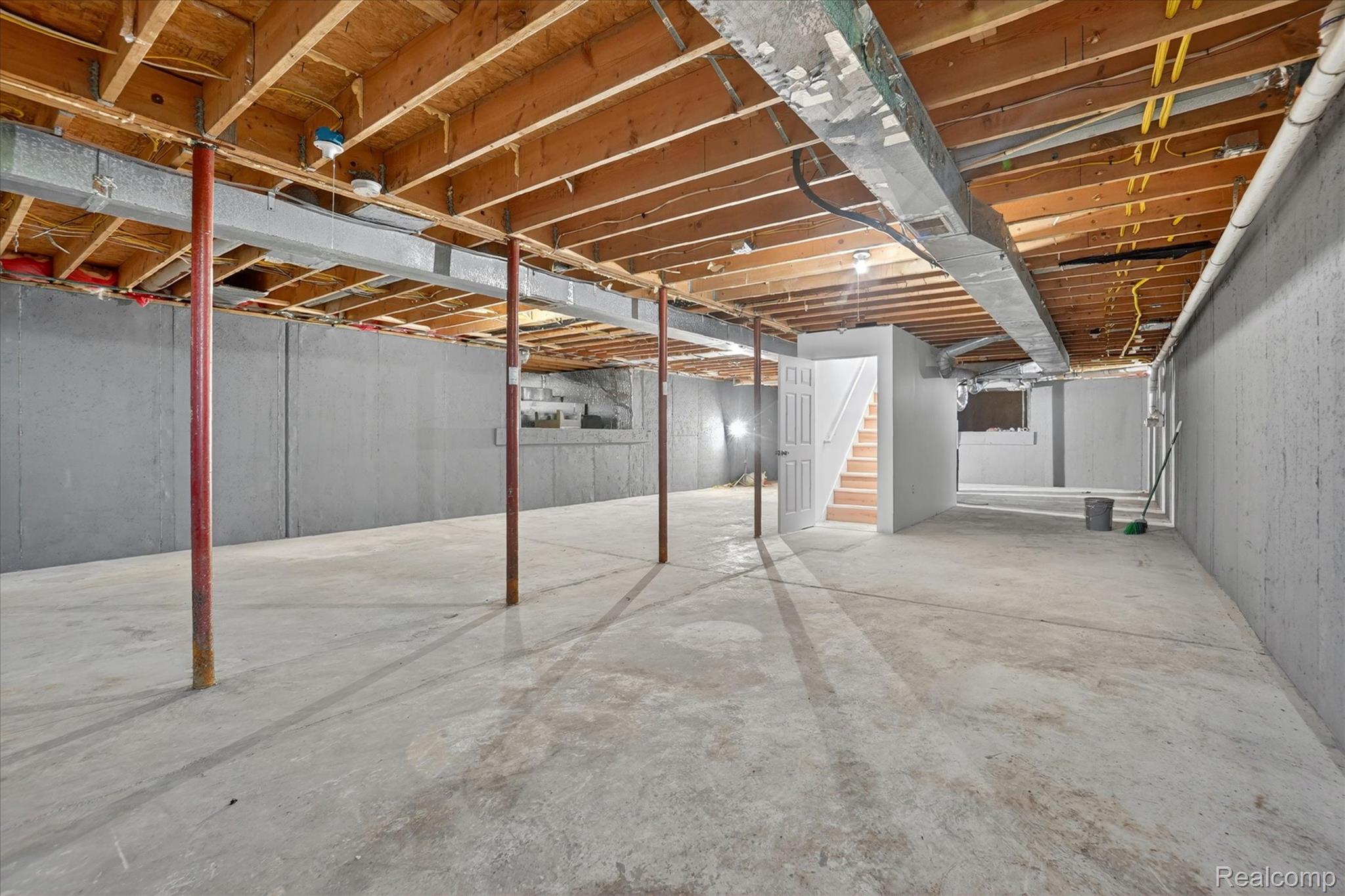 1400 North Every Road Mason, MI 48854 - Photo 26 of 33 Unfinished basement with concrete flooring and exposed ceiling joists