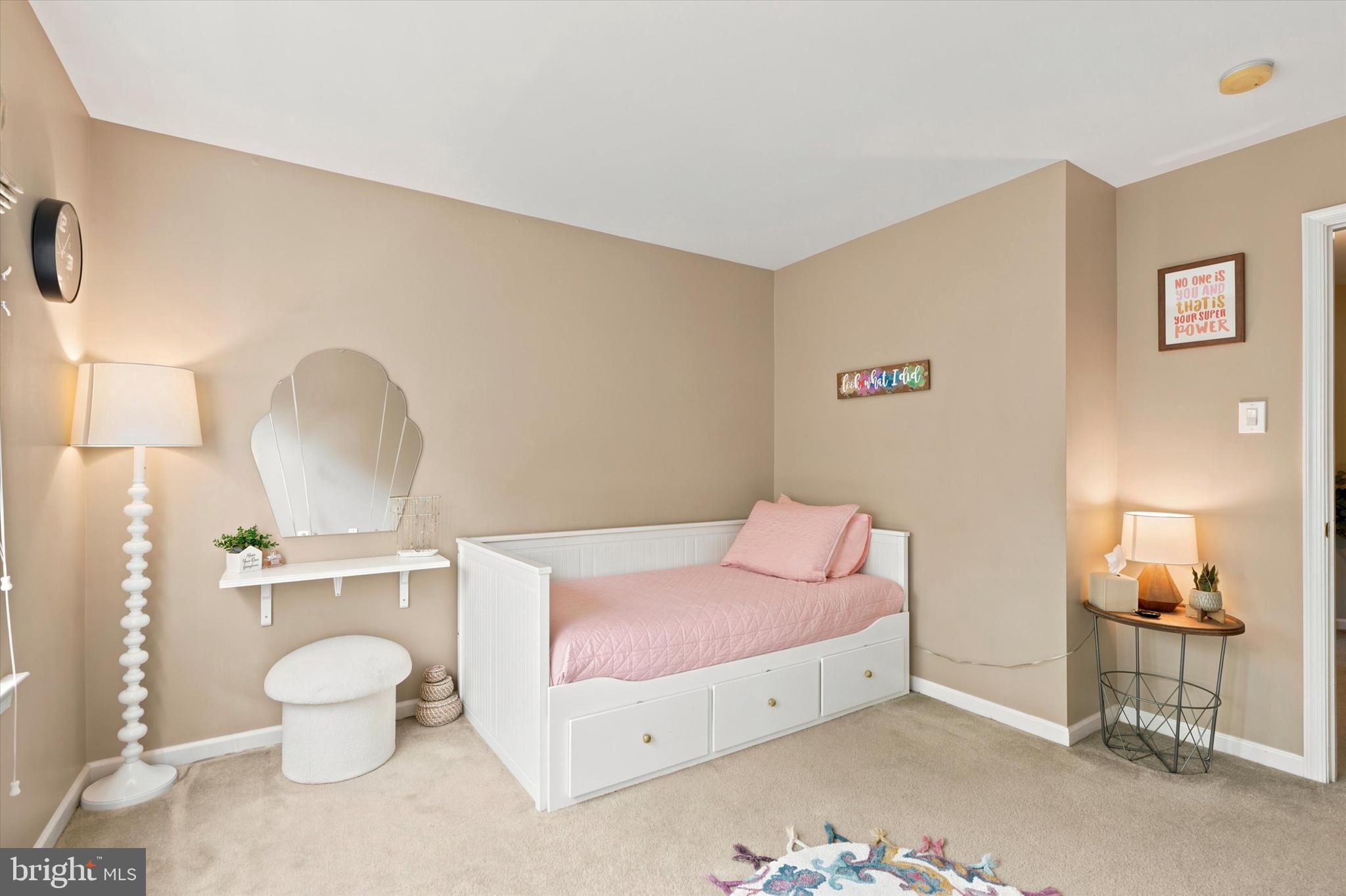 215 Flagstone Road, Unit 1 Chester Springs, PA 19425 - Photo 16 of 33 a bedroom with a bed and a chandelier