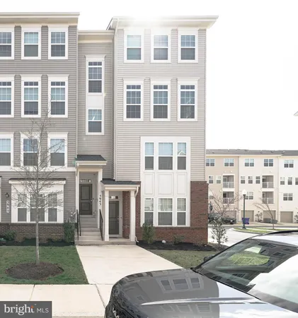 a view of a building with a yard