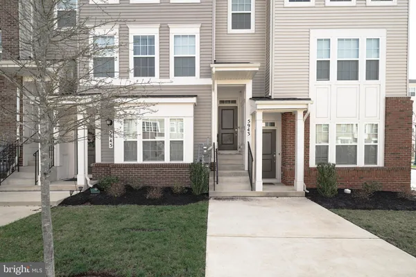 a view of house with yard