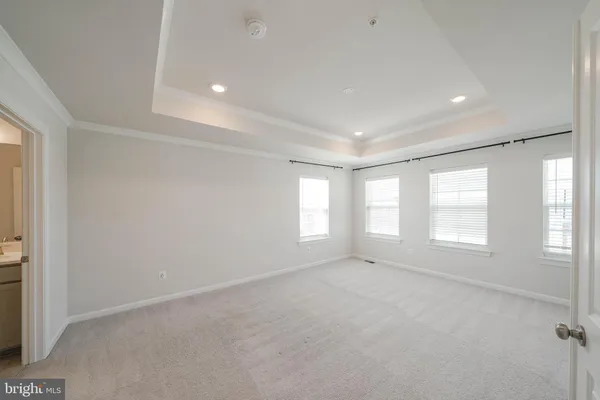 a view of empty room with windows