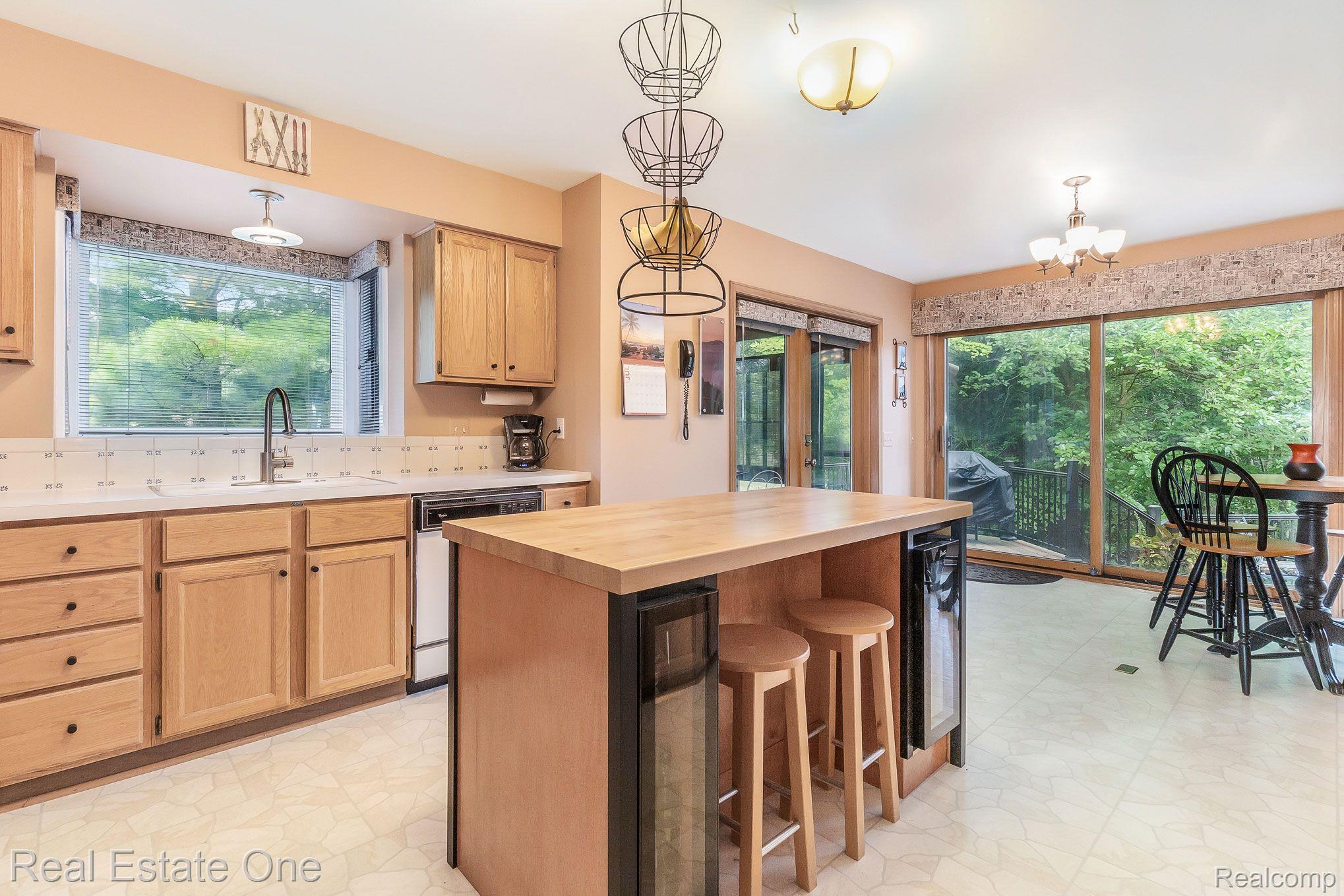 21781 Garfield Road Northville, MI 48167 - Photo 20 of 43 KITCHEN SHOWING EAT IN AND SUN ROOM