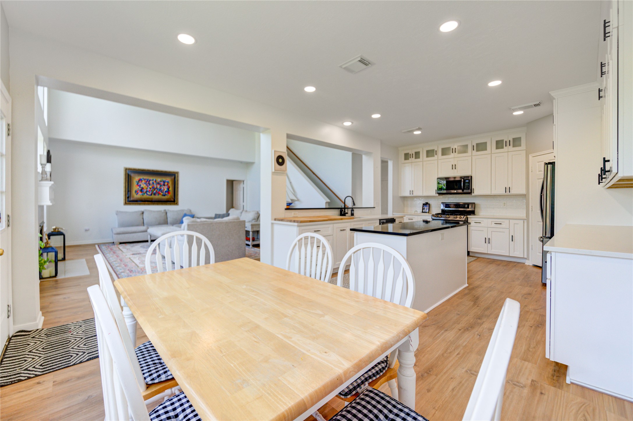 10906 Trail Ridge Drive Houston, TX 77064 - Photo 16 of 41 Bright open-concept design featuring a combined kitchen, breakfast area, and living room perfect for modern living.