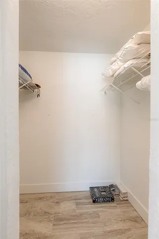 a view of a swimming pool with a lounge chair