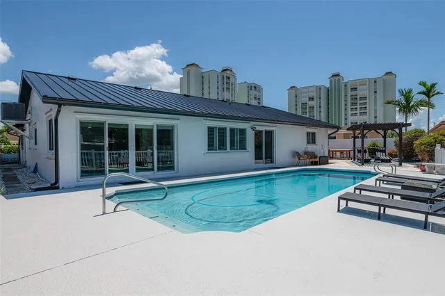 a view of a patio with a dining table and chairs