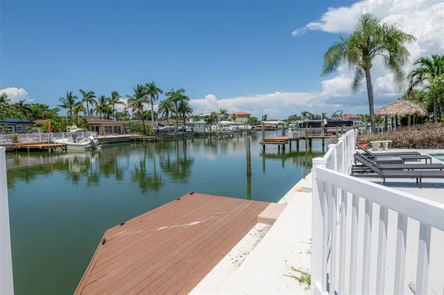 an aerial view of a house with a lake view