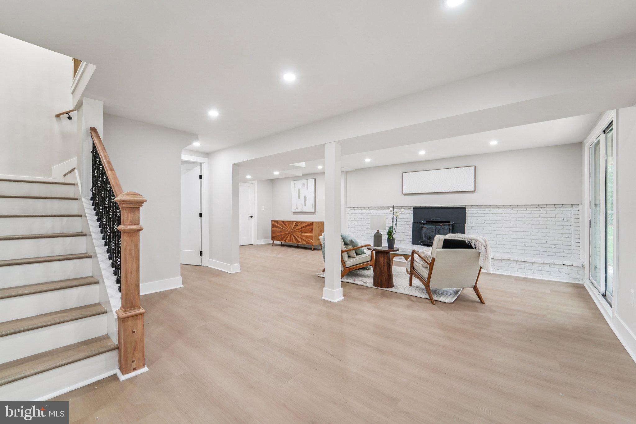 9168 Fort Smallwood Road Pasadena, MD 21122 - Photo 15 of 42 a view of a livingroom with furniture and a flat screen tv