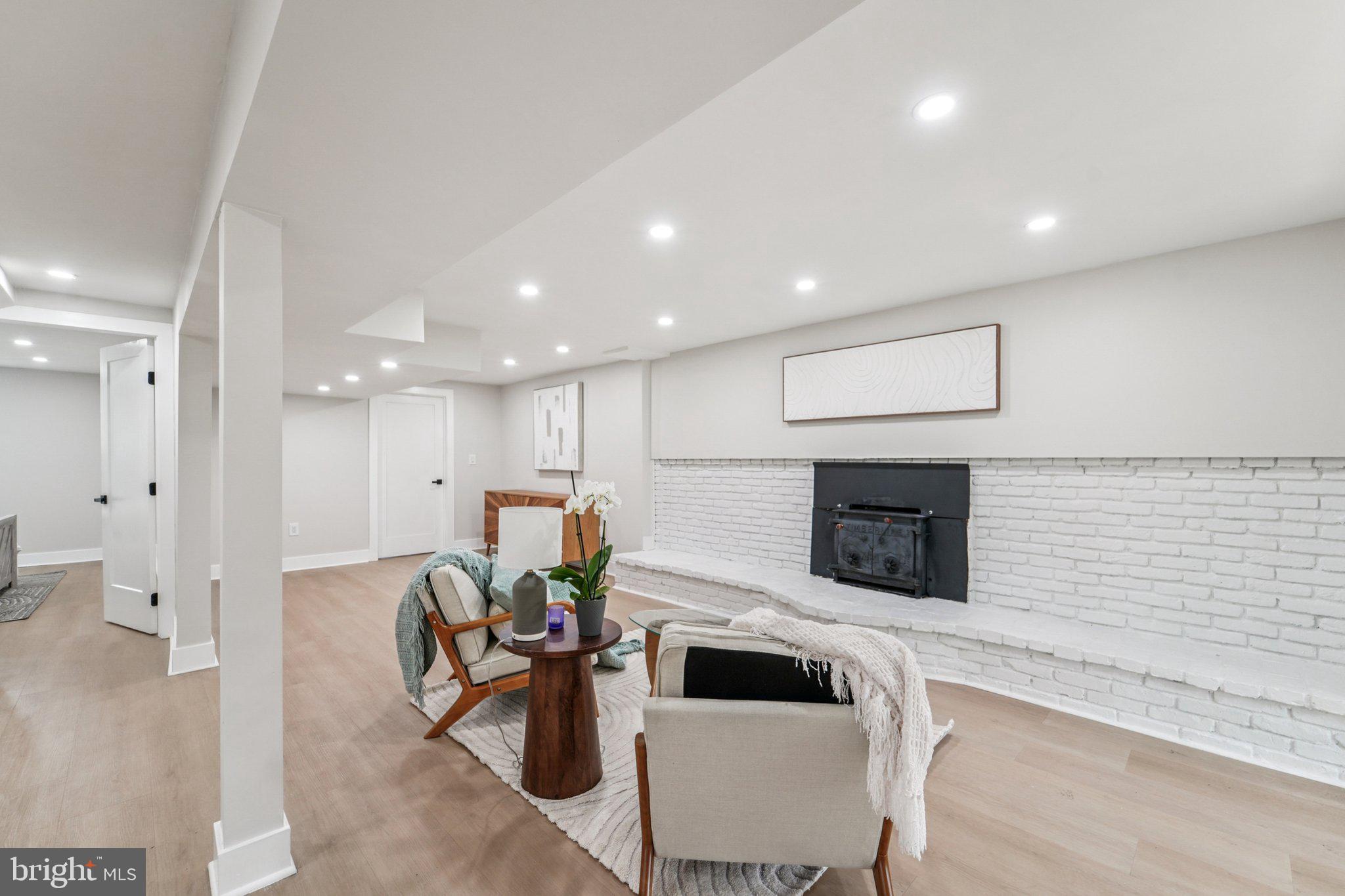 9168 Fort Smallwood Road Pasadena, MD 21122 - Photo 17 of 42 a kitchen with stainless steel appliances kitchen island granite countertop a sink and a refrigerator