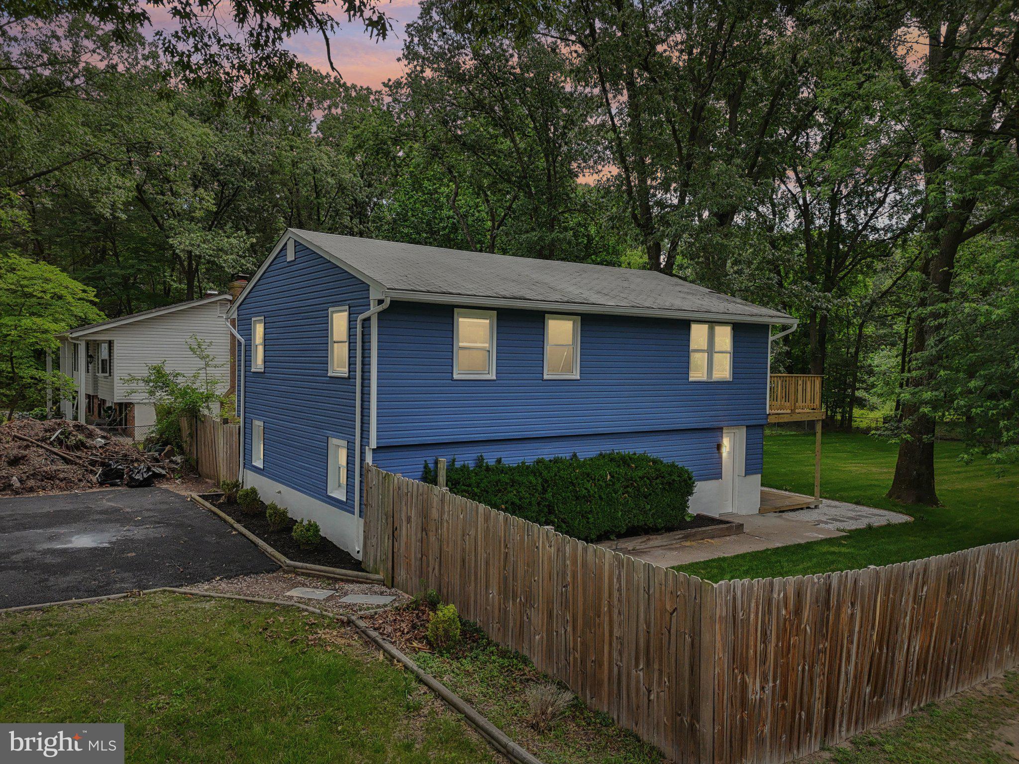 9168 Fort Smallwood Road Pasadena, MD 21122 - Photo 19 of 42 a front view of a house with yard