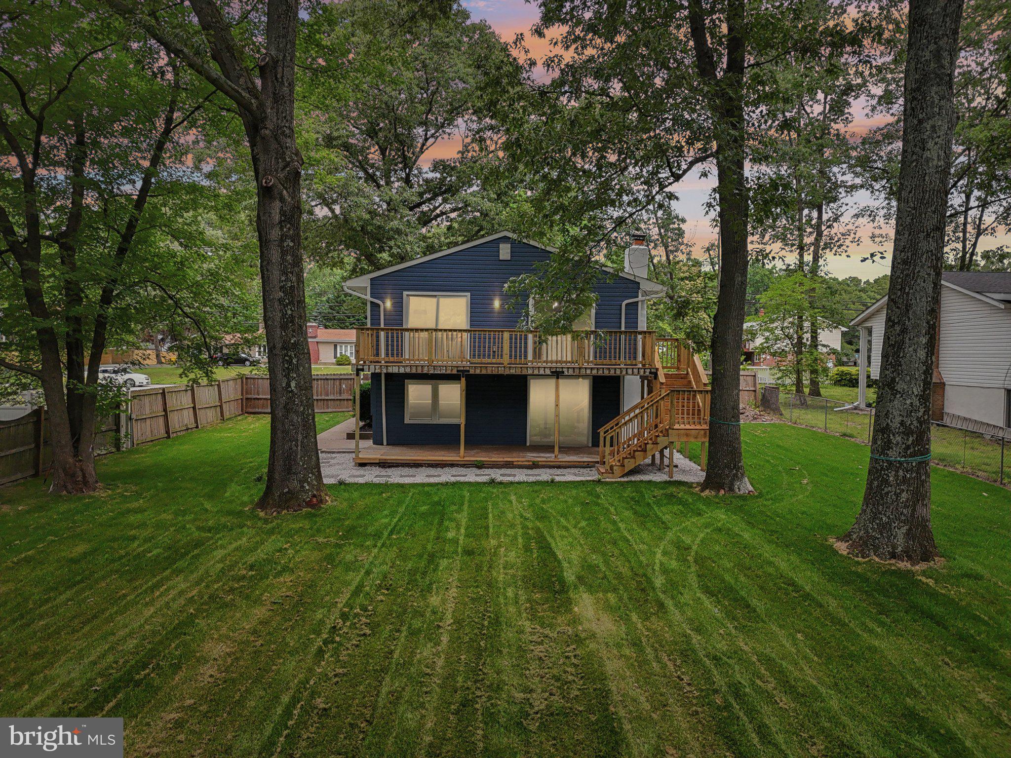 9168 Fort Smallwood Road Pasadena, MD 21122 - Photo 20 of 42 a view of a house with a yard