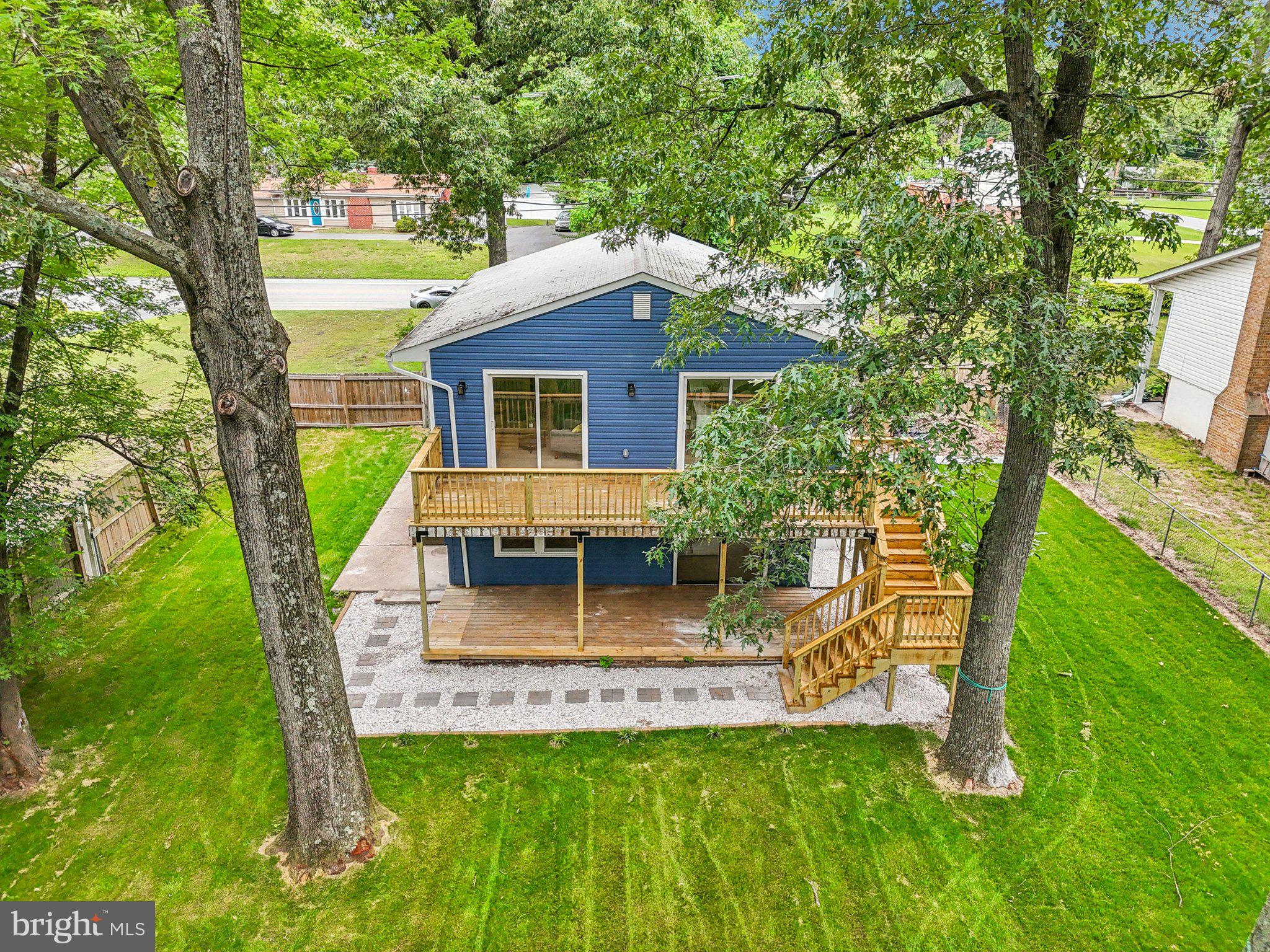 9168 Fort Smallwood Road Pasadena, MD 21122 - Photo 2 of 42 a view of a house with a yard porch and sitting area