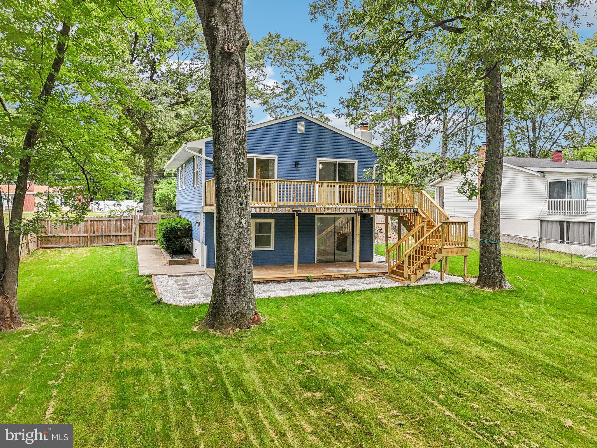 9168 Fort Smallwood Road Pasadena, MD 21122 - Photo 24 of 42 a view of a house with a yard and sitting area