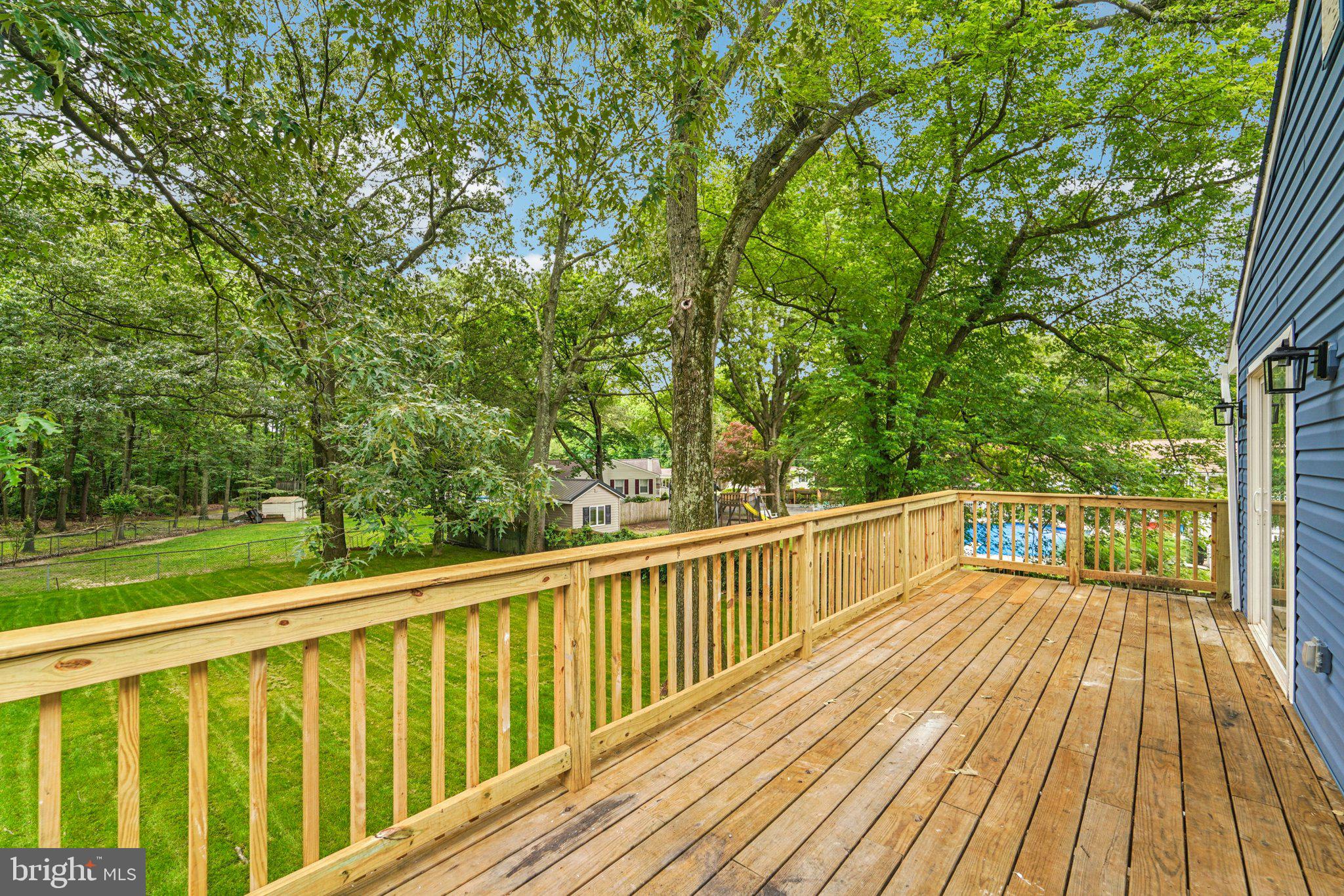9168 Fort Smallwood Road Pasadena, MD 21122 - Photo 29 of 42 a view of balcony with wooden floor and fence