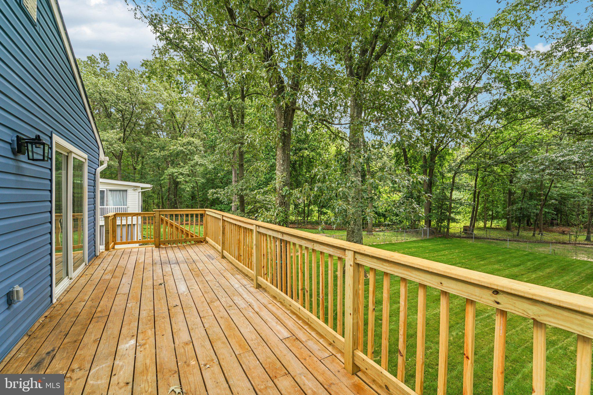 9168 Fort Smallwood Road Pasadena, MD 21122 - Photo 31 of 42 a view of balcony with wooden floor and fence