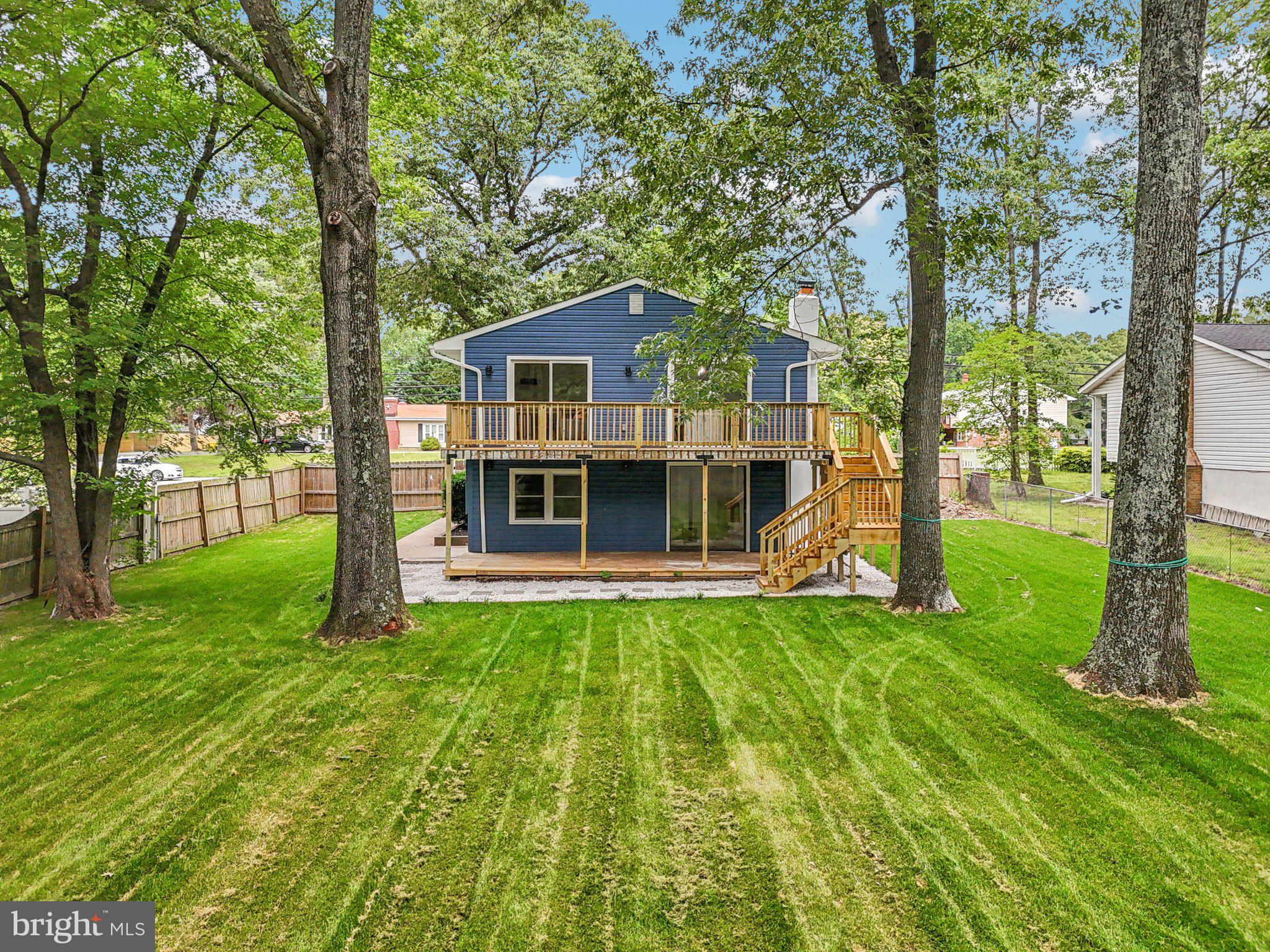 9168 Fort Smallwood Road Pasadena, MD 21122 - Photo 37 of 42 a view of a house with a yard
