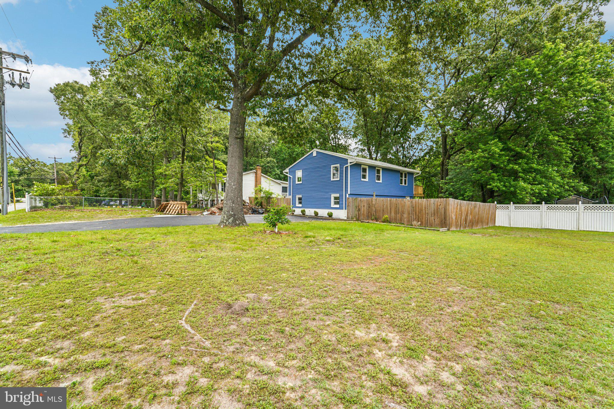 9168 Fort Smallwood Road Pasadena, MD 21122 - Photo 39 of 42 a view of a house with a yard