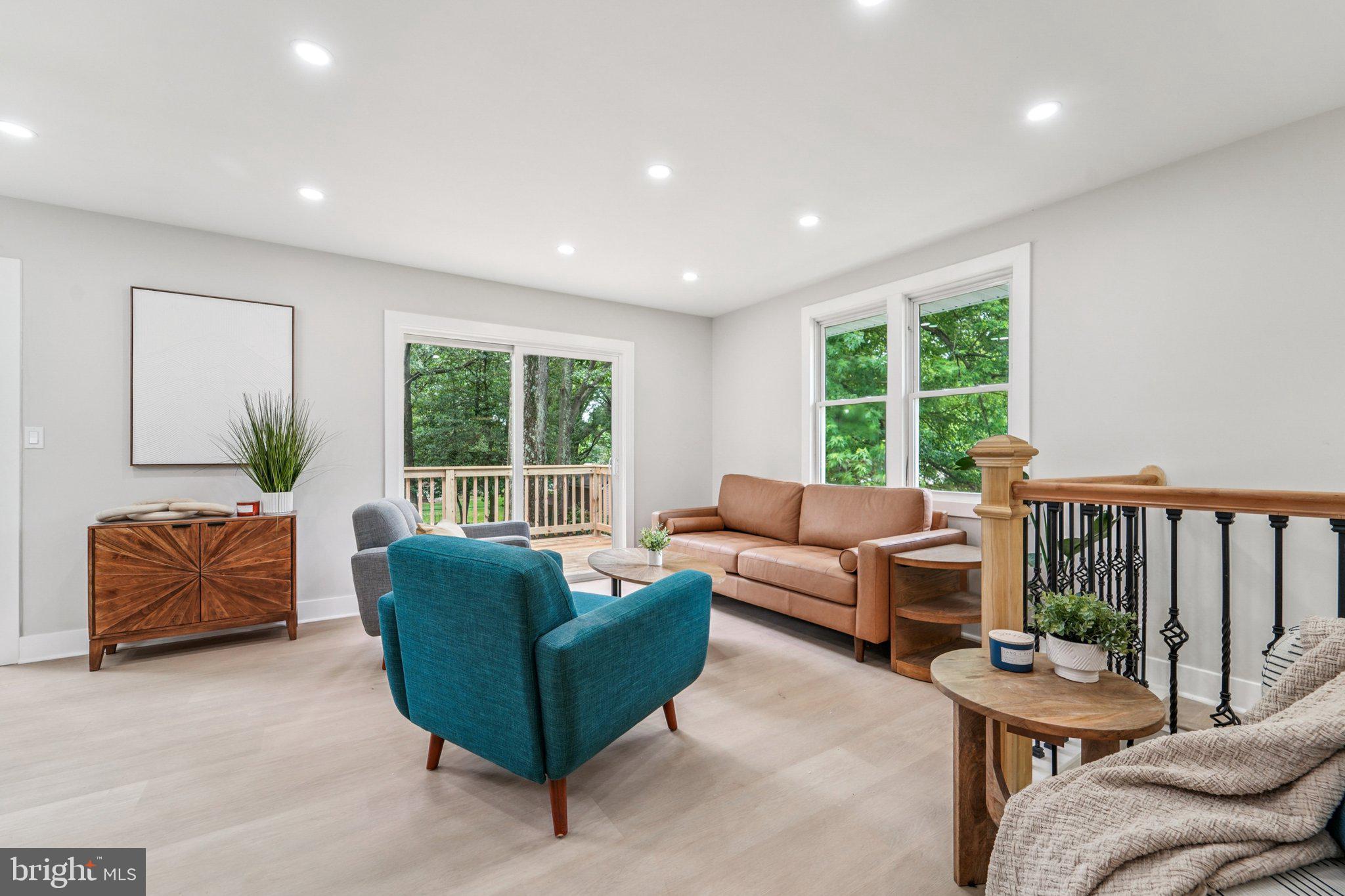 9168 Fort Smallwood Road Pasadena, MD 21122 - Photo 6 of 42 a living room with furniture and a large window